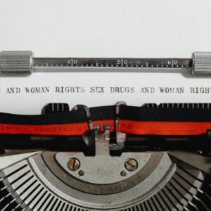 Close-up of a vintage typewriter with typed words advocating women's rights.