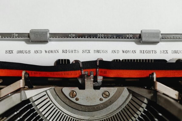 Close-up of a vintage typewriter with typed words advocating women's rights.